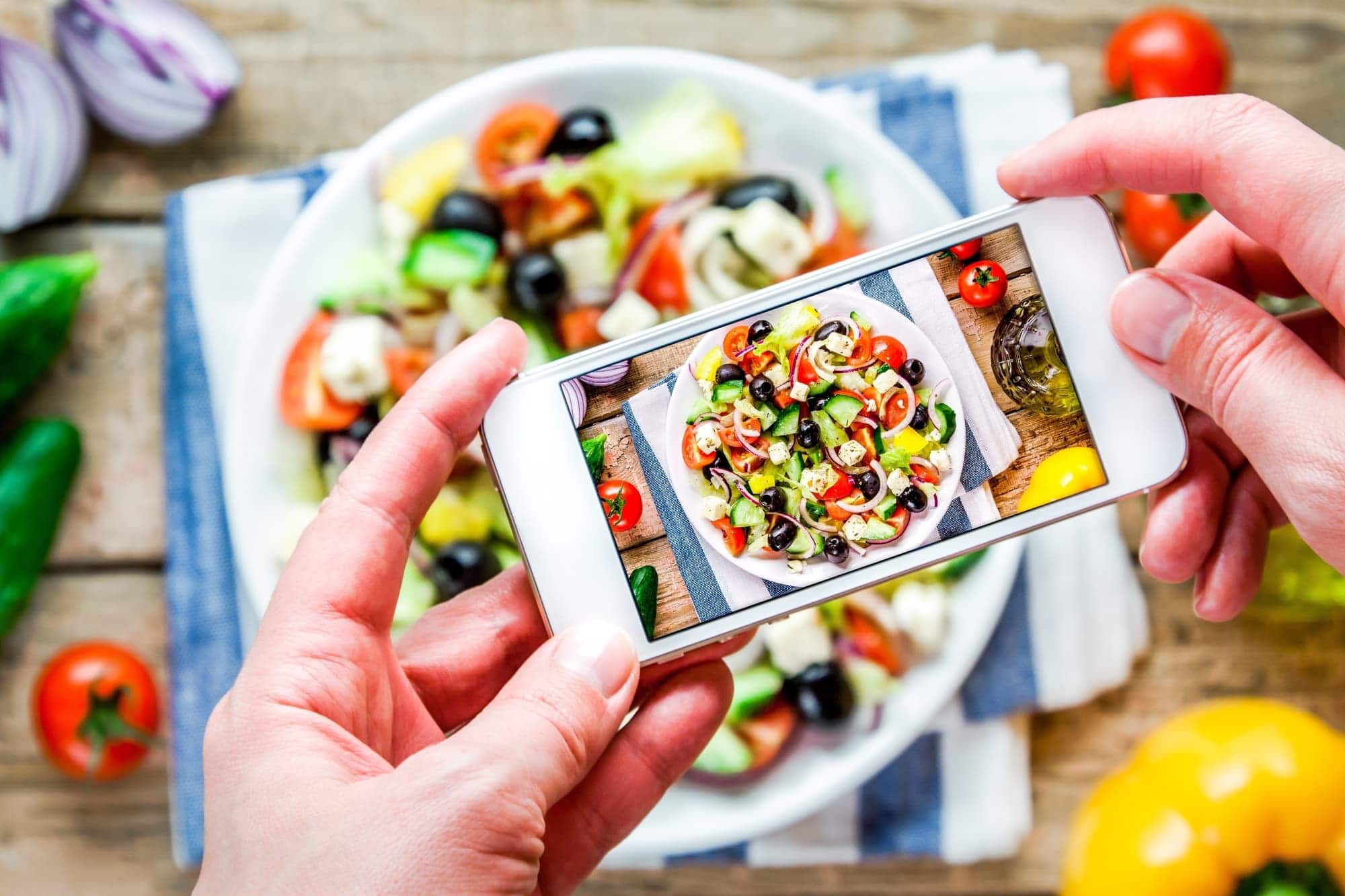 person getting paid to take picture of food with phone